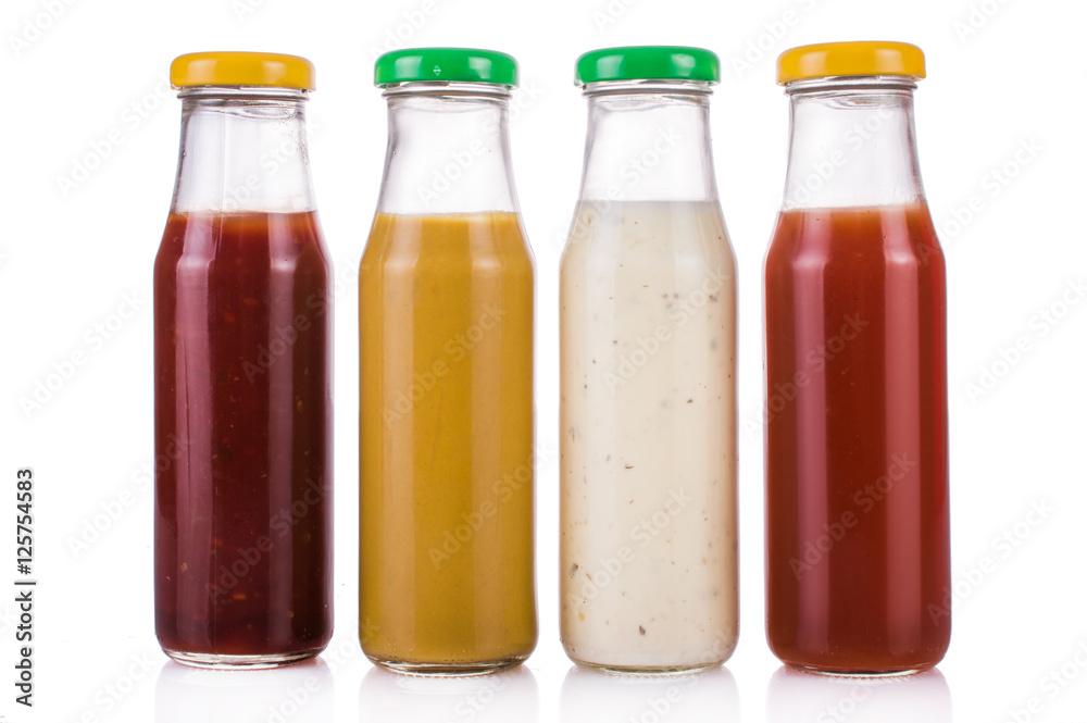 Bottled sauces. On white, isolated background.