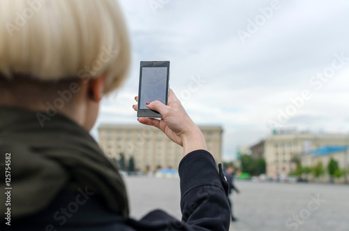 Young girl makes selfie