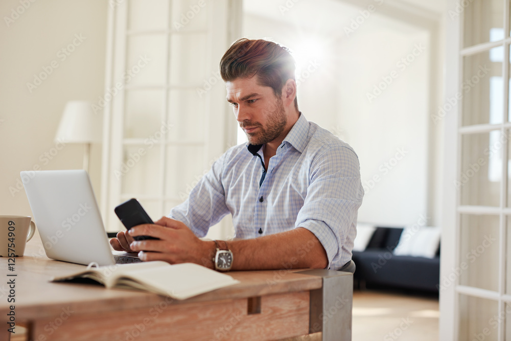 Young caucasian man working on laptop
