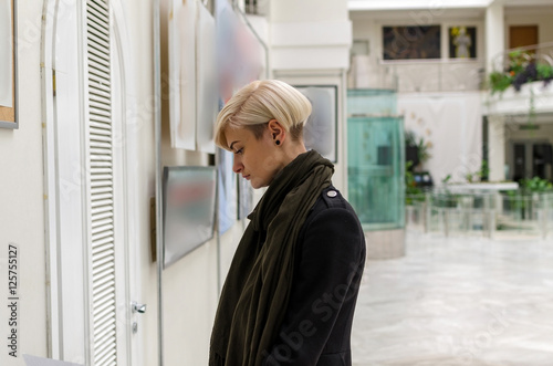 Young girl walking in the art gallery