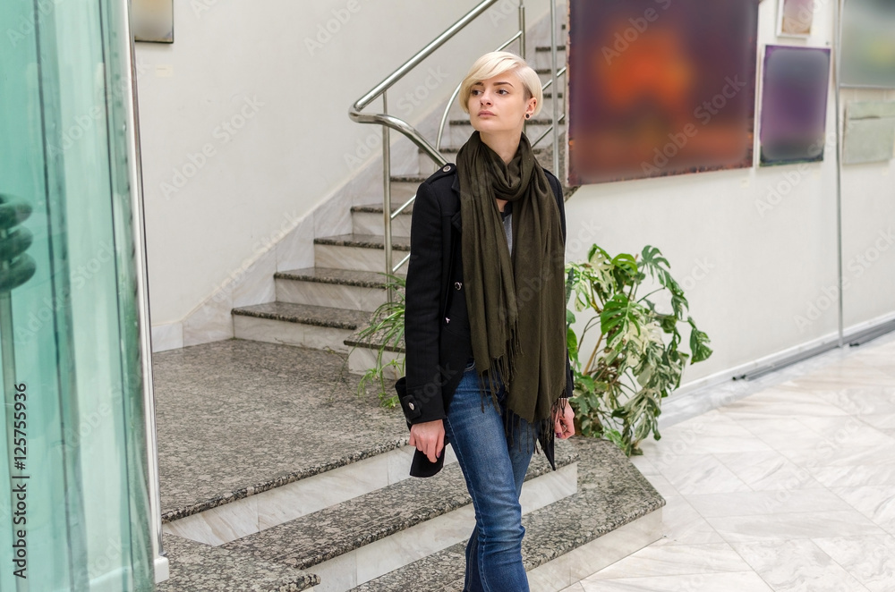 Young girl walking in the art gallery Young girl walking in the art gallery