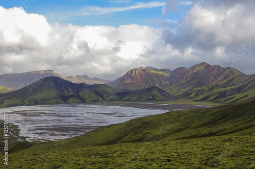 Lake and moss-covered volcanic mountains. Landmannalaugar. Iceland
