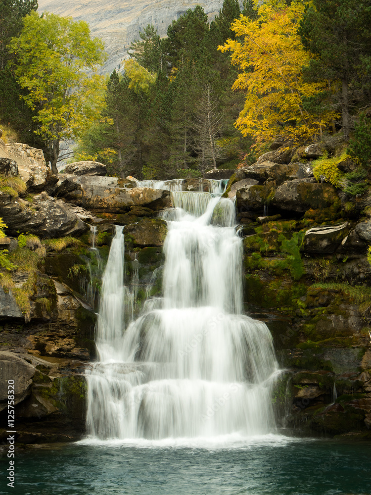 Waterfall in the mountains in autumn
