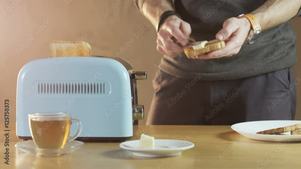 Man Butters a Loaf of Bread Man Butters a Loaf of Bread