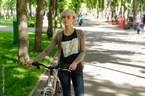 Young girl with a bicycle