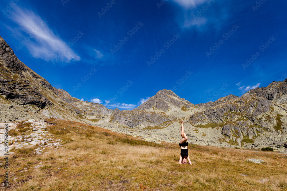 Yoga headstand in Tatry mountains