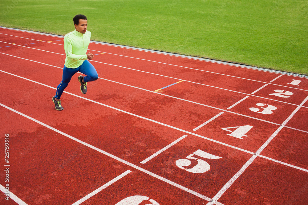 Fototapeta premium Running african man at stadium