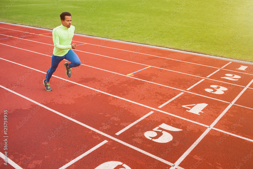 Running african man at stadium Running african man at stadium