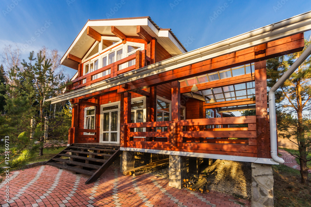 The Log Home with Large Porch at sunset