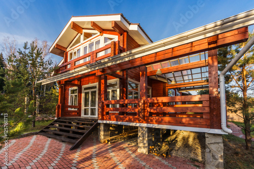 The Log Home with Large Porch at sunset