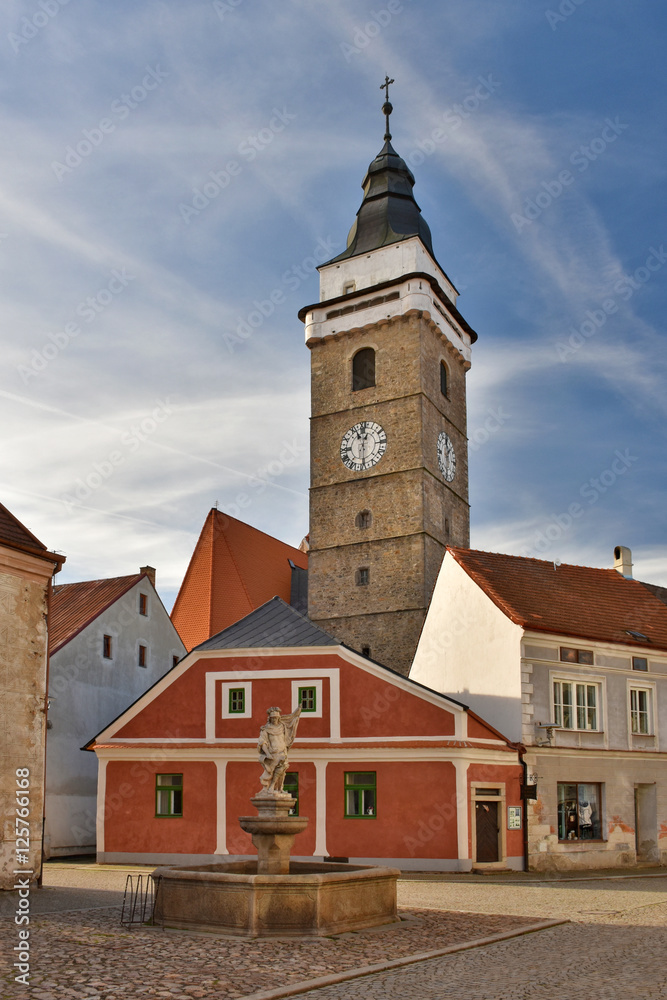 Fototapeta premium Renaissance church tower and old town houses in Slavonice, Czech Republic