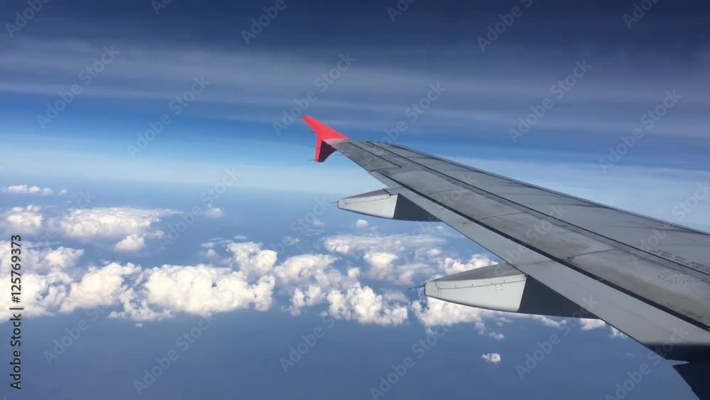 Airplane Wing Flying Through Clouds. Airplane Wing Flying Through Clouds.