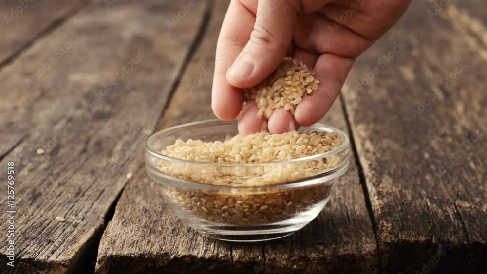 Hand takes rice Hand takes rice