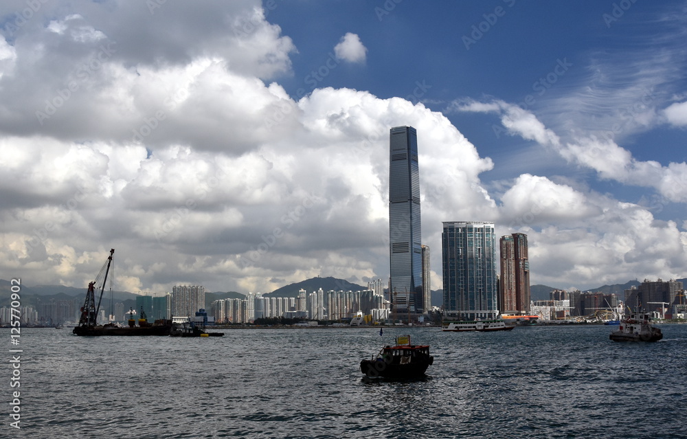 Hong Kong, China - Oct 28, 2016. View of Kowloon island skyline across Victoria Harbour from Macau Ferry Terminal. Skyscrapers on waterfront in downtown.