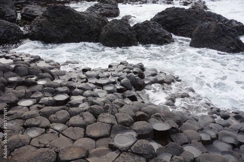 Giant Causeway hexagonal interlocking basalt column rocks in Northern Ireland Giant Causeway hexagonal interlocking basalt column rocks in Northern Ireland