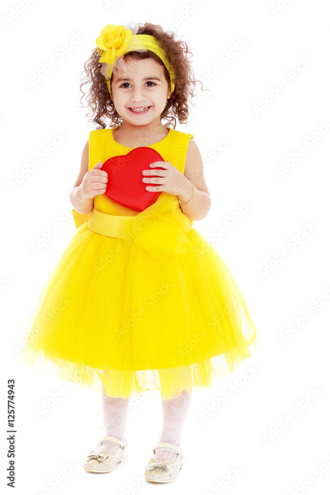 Cute little girl holds heart