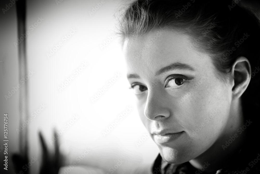 Fototapeta premium Black and White Photo of a Woman in a Scarf
