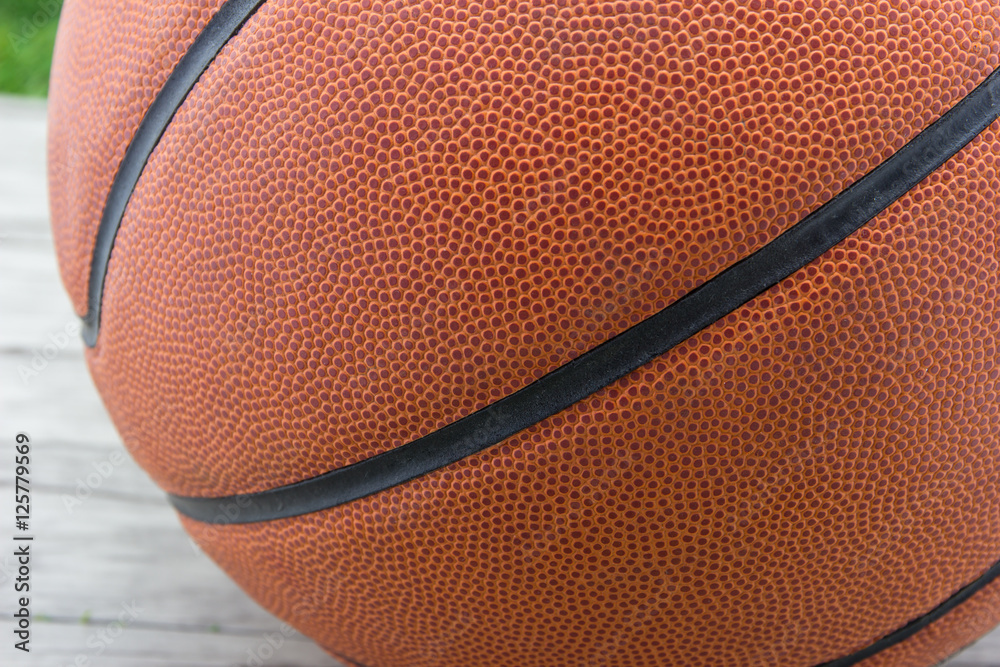 Obraz premium Basketball ball on wood background