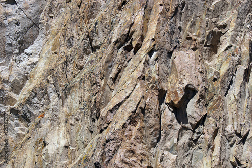 Detail, tectonic warping of volcanic rhyolite rocks photo