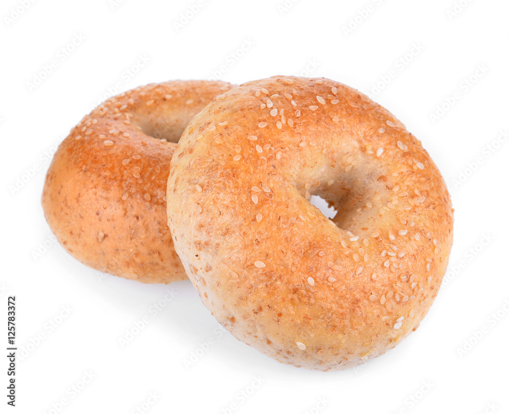 Sesame seeded bagel viewed from above isolated against white Sesame seeded bagel viewed from above isolated against white