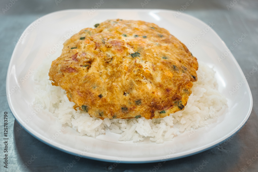 Omelet on Thai Jasmine Rice with carrot and spring onion and pork Omelet on Thai Jasmine Rice with carrot and spring onion and pork