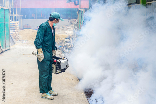 Man work fogging to eliminate mosquito for prevent spread dengue fever and zika virus