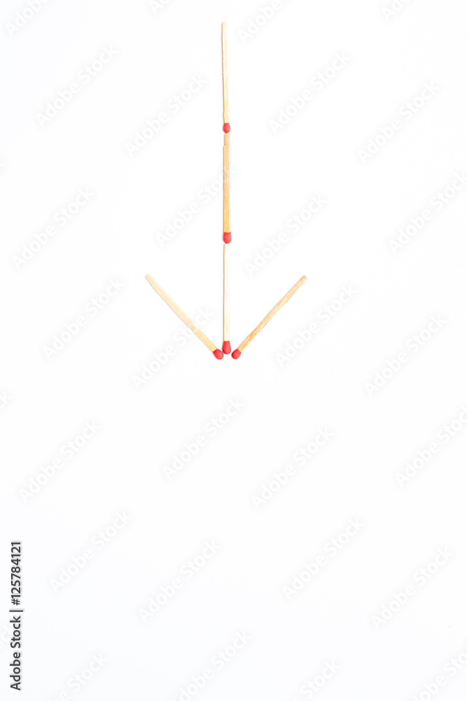 Matches stick arranged in arrow sign close up isolated. Matches stick arranged in arrow sign close up isolated.