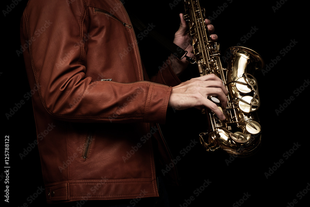 Obraz premium Jazz saxophone musician in the leather jacket, closeup.