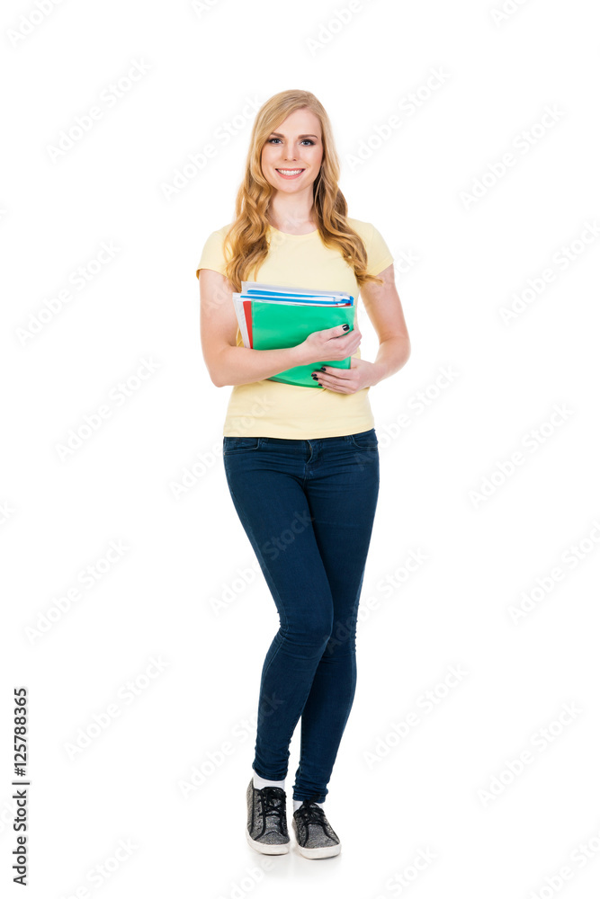 Young and attractive teenage schoolgirl on white
