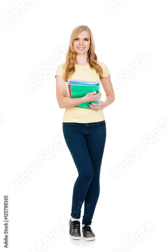 Young and attractive teenage schoolgirl on white