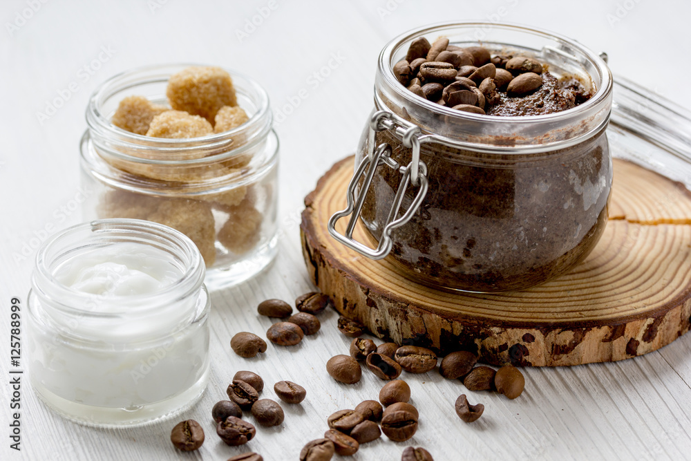 homemade coffe scrub in glass jar on wooden background homemade coffe scrub in glass jar on wooden background