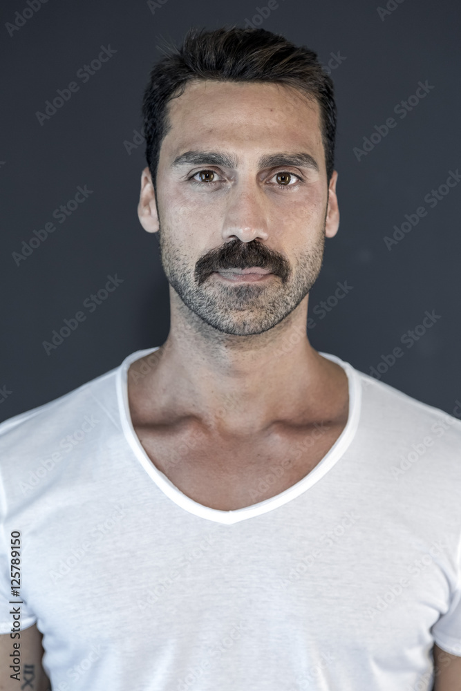 Young and attractive man with mustache studio portrait Young and attractive man with mustache studio portrait