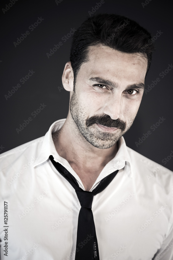 Fototapeta premium Handsome man with mustache studio portrait