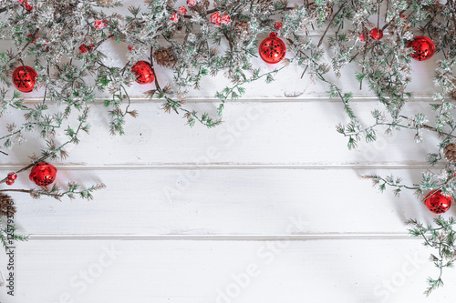 Christmas wooden background. Christmas jingle bells with pine