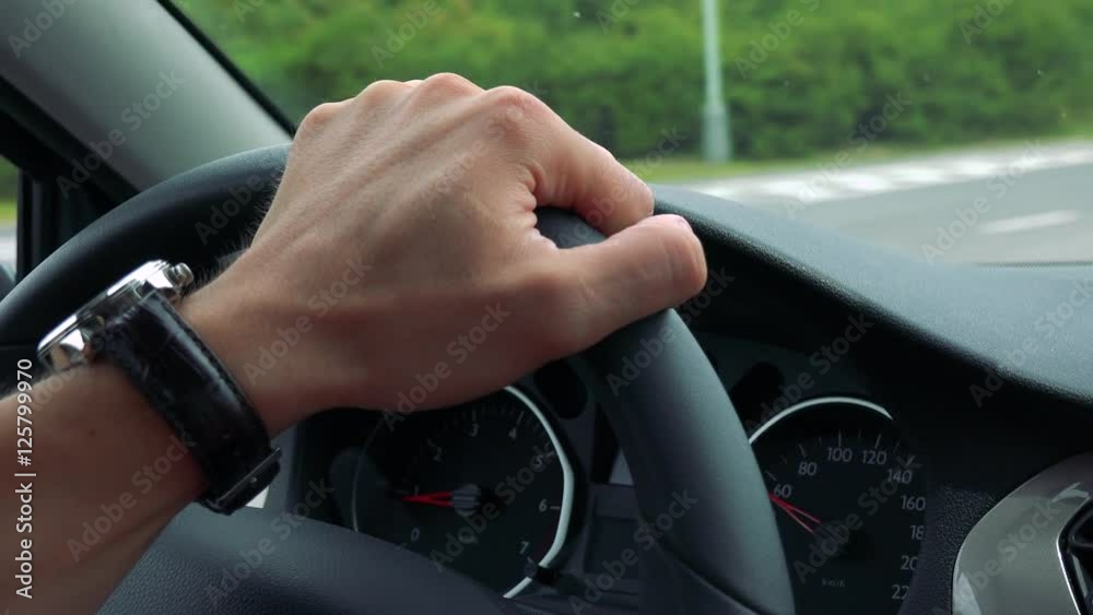 custom made wallpaper toronto digitalman drives a car in the town - detail of steering wheel with hand