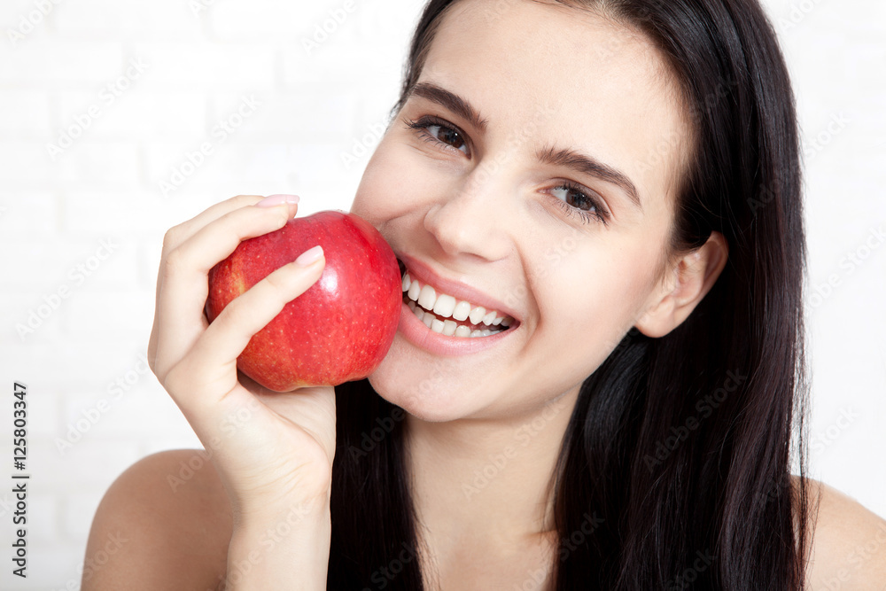 Woman with apple close-up face. Beautiful women exists to clean skin on the face. Concept of natural food. Asian woman. Woman with apple close-up face. Beautiful women exists to clean skin on the face. Concept of natural food. Asian woman.