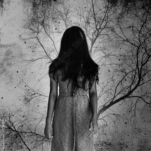 Ghost woman with dead tree in background