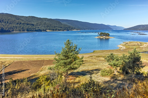 Autumn Landscape with island in the water of Dospat Reservoir, Smolyan Region, Bulgaria