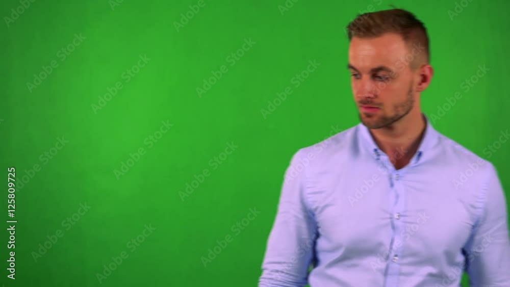 young handsome business man walks and thinks about something - green screen young handsome business man walks and thinks about something - green screen