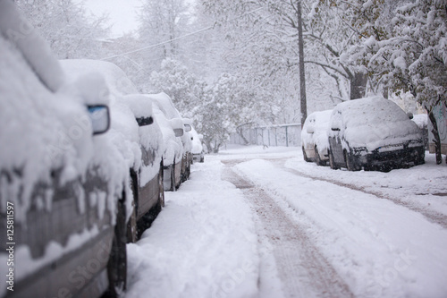 Parked cars covered with snow - snow storm