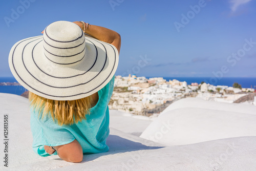Young woman on holidays  Santorini Oia town
