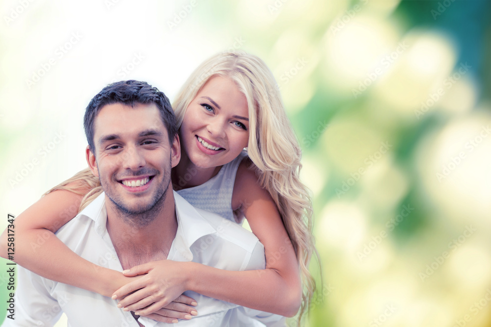 happy couple having fun over green background happy couple having fun over green background