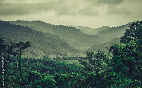 Tropical mountains of Vietnam. Provinces Nha Trang. Cloudy weather, tropical rain and fog.The view from the heights. photo