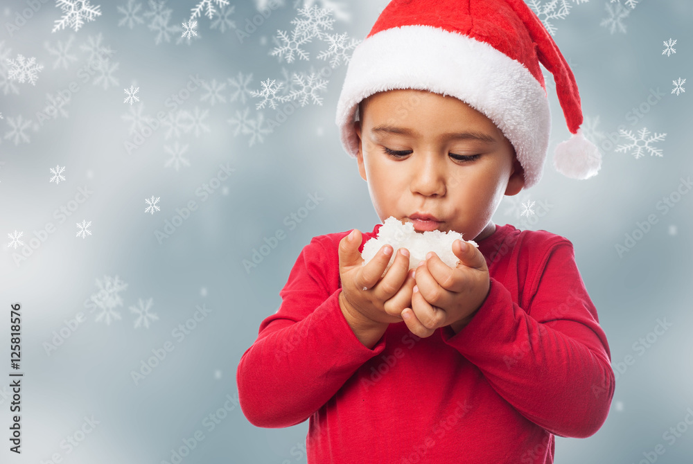 portrait of a little boy blowing a snowball portrait of a little boy blowing a snowball
