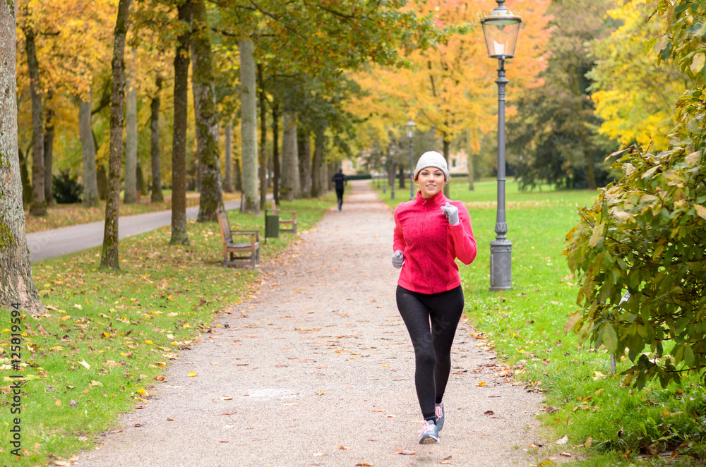 Fototapeta premium Attractive shapely young woman out jogging