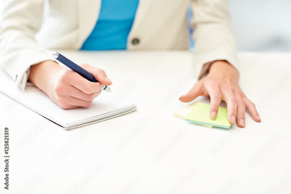 close up of woman with to notepad at office close up of woman with to notepad at office