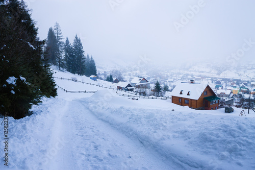 winter village landscape in Carpathian mountains © photo_superteam