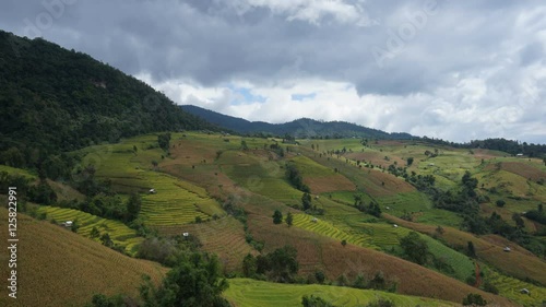 Movement of light over the Rice fields on terraced at Mae Cham, Chiang Mai, Thailand. Beautiful scene of famous terrace rice field in Thailand. Harvesting season.