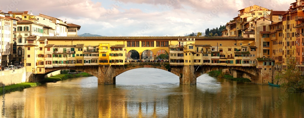 Panorama view of Ponte Vecchio over Arno river in Florence, Italy