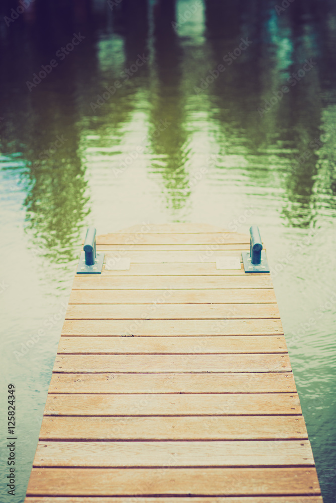 Fototapeta premium Wooden wharf and blue water
